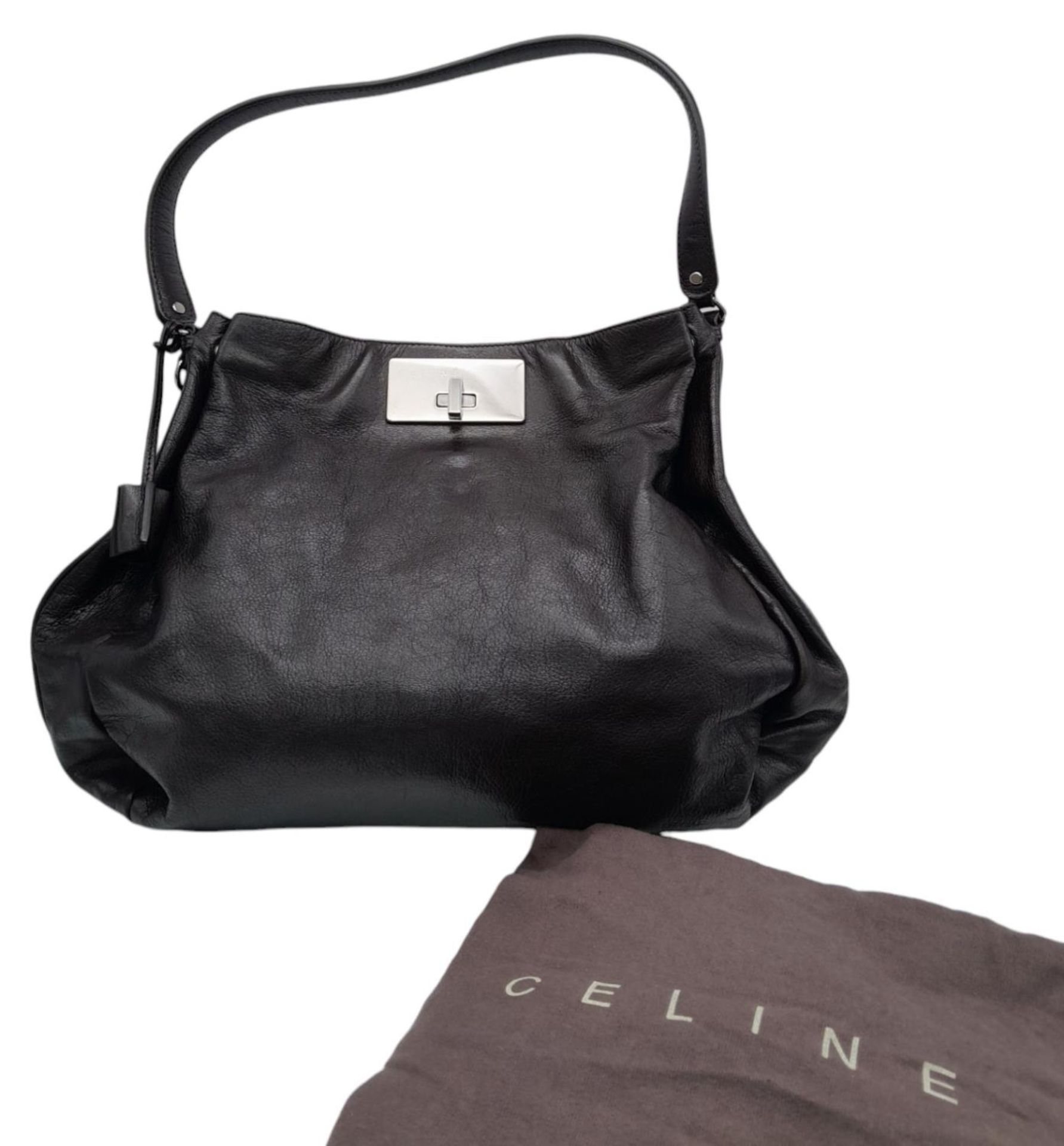 A Celine Dark Brown Shoulder Bag. Leather exterior with silver-toned hardware, single strap, press - Bild 6 aus 10