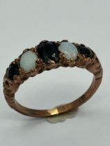 Vintage 9 carat GOLD and OPAL RING. Consisting Opals and oval cut SPINEL set to top in a 9 carat