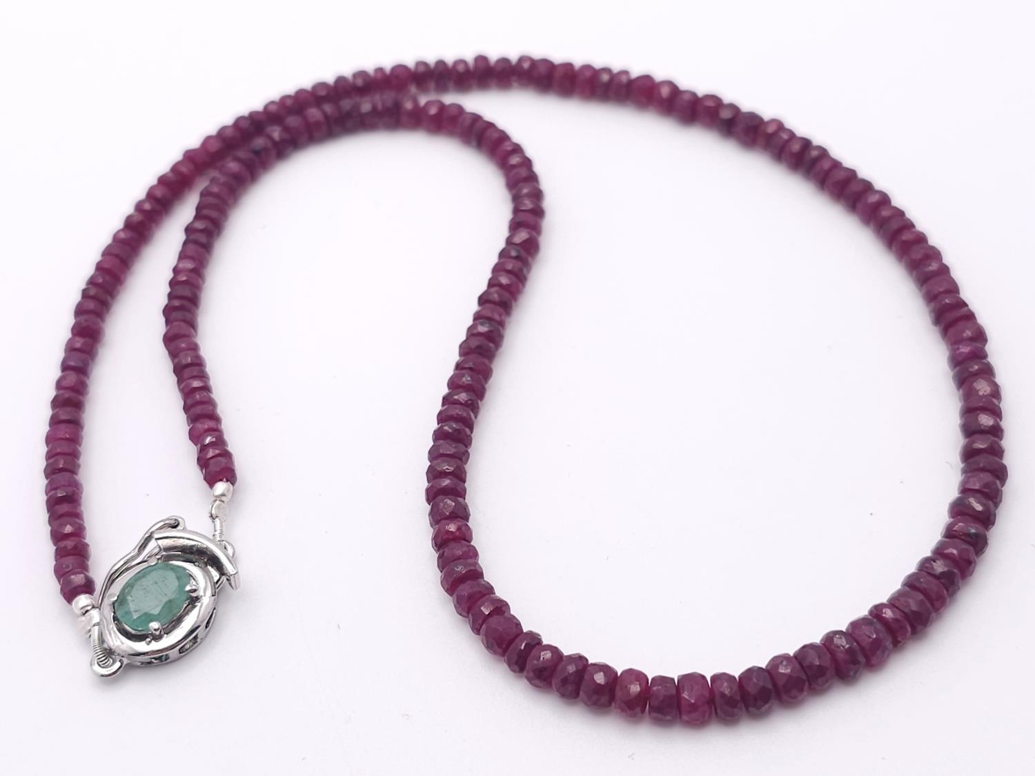 A 110ctw Ruby Rondelle Gemstone Single Strand Necklace with Emerald and 925 Silver clasp. 44cm. Ref: