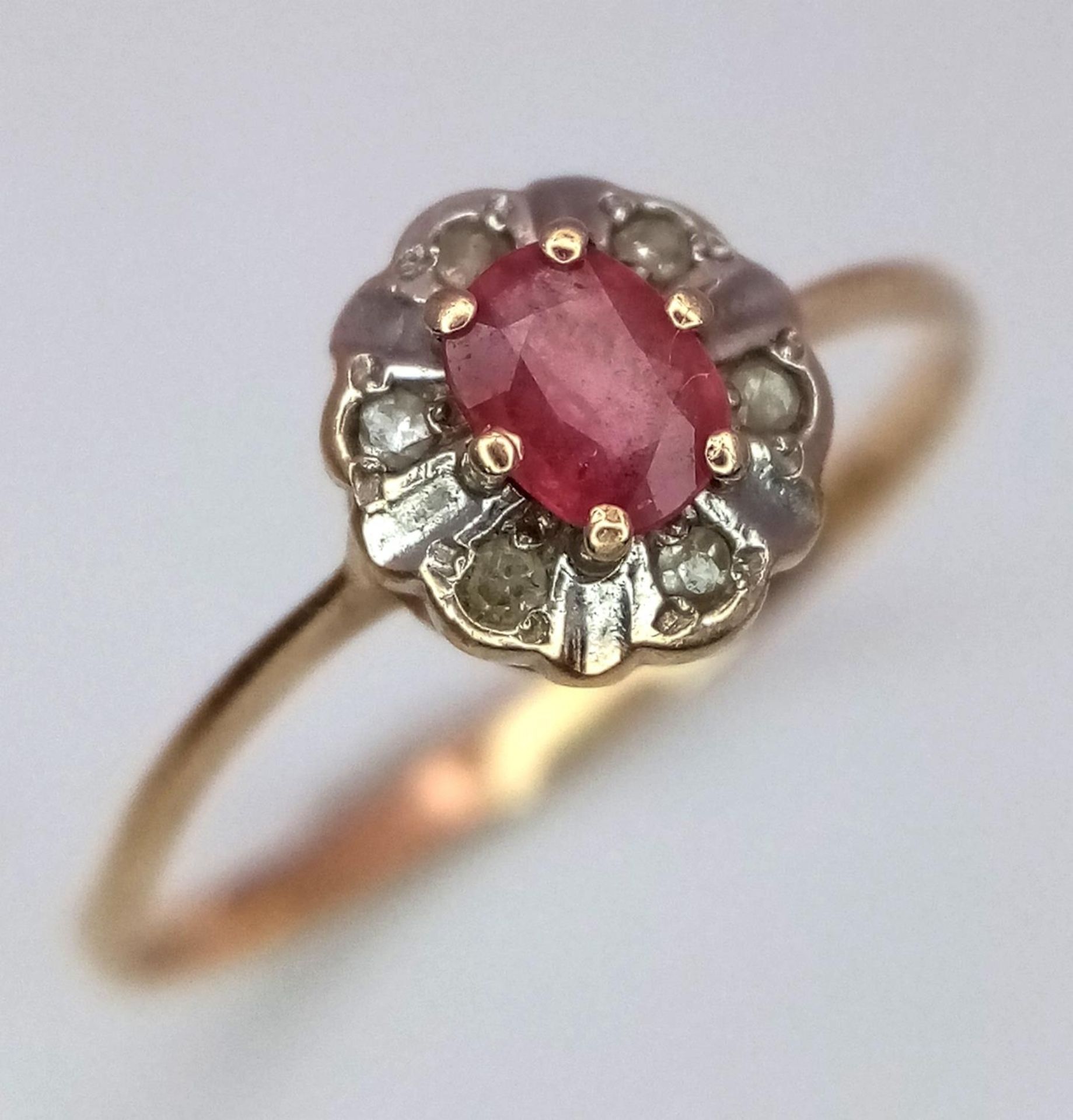 A 14K (TESTED) YELLOW GOLD DIAMOND & RUBY RING. Size K, 0.9g total weight. Ref: SC 9032