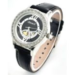 An Ingersoll Automatic Skeleton Ladies Watch. Black leather strap. Stainless steel case - 32mm.