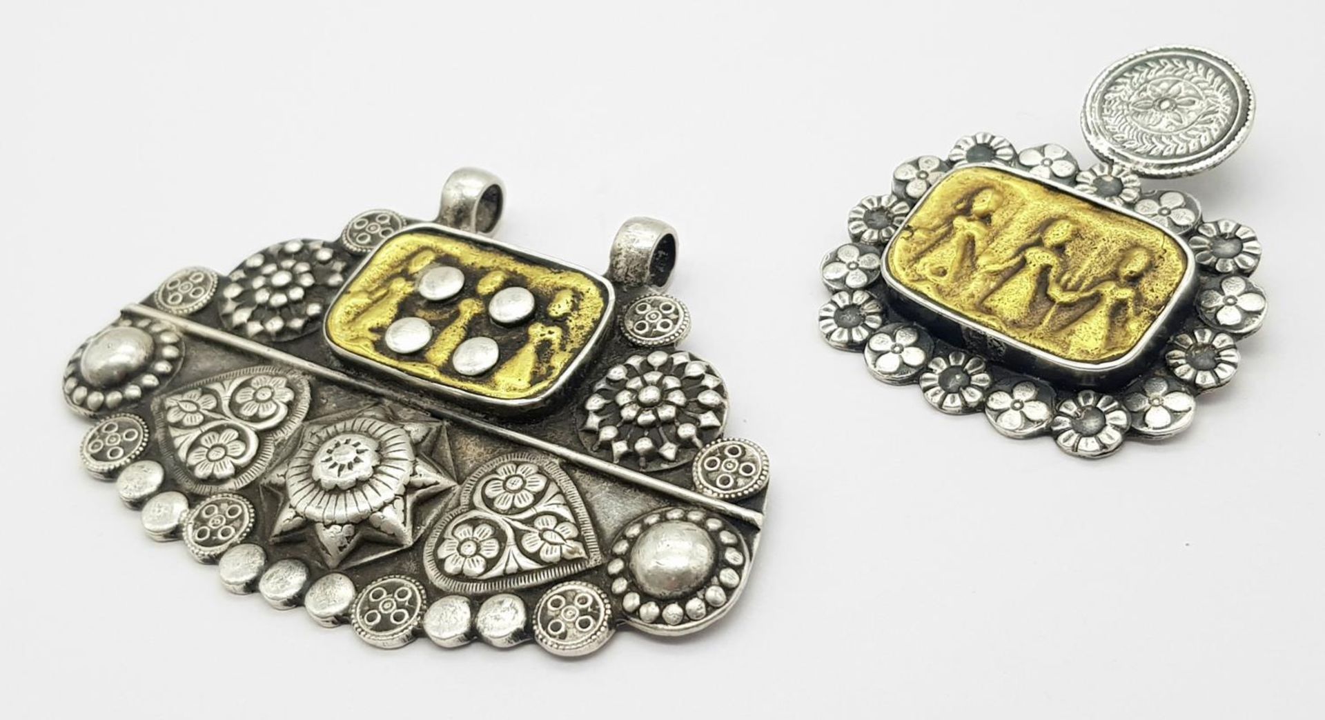 Two Antique Indian Silver Amulets. Floral and children decoration. 8cm and 5cm. 84g - Image 2 of 4
