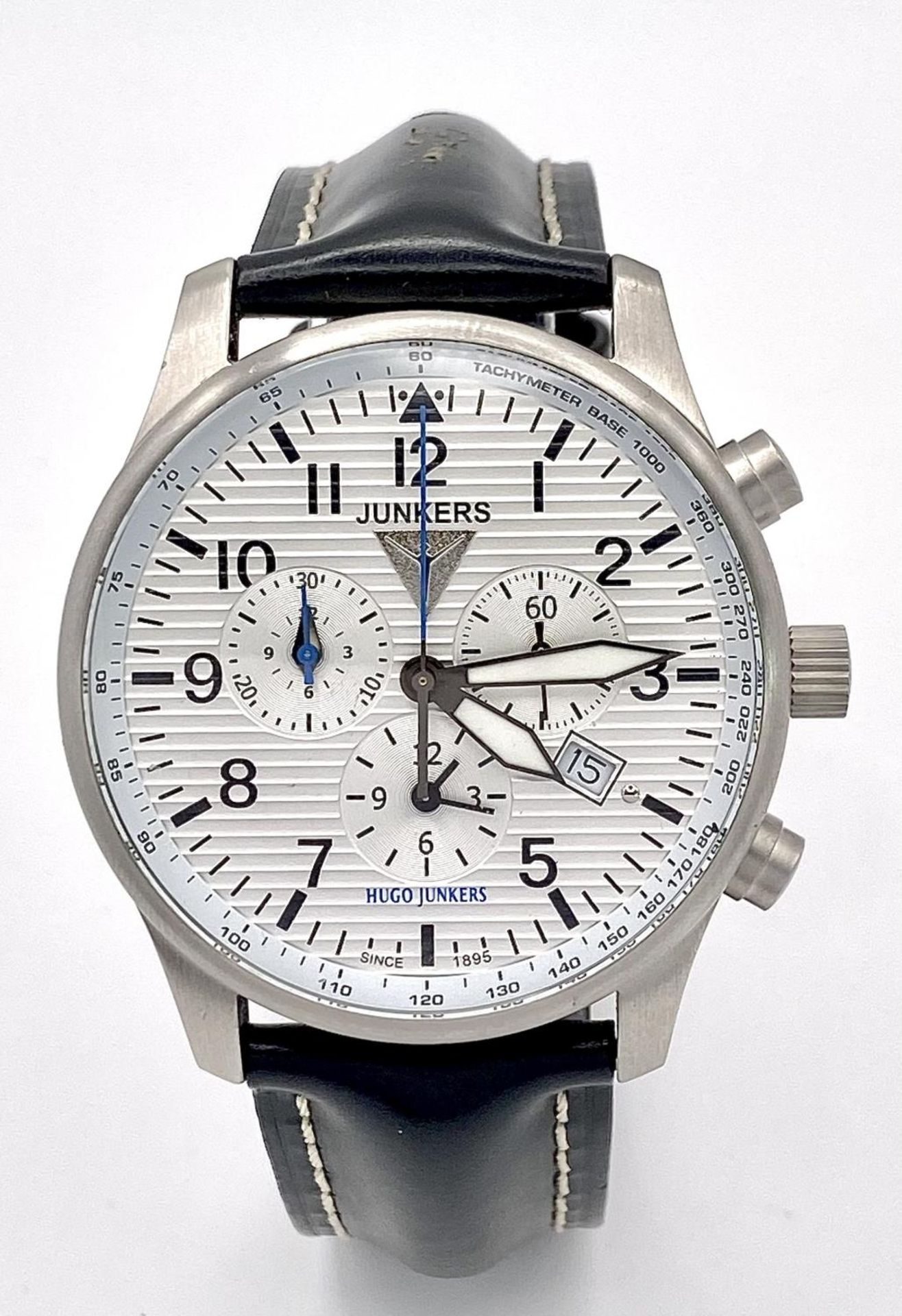 A Junkers Chronograph Quartz Gents Watch. Black leather strap. Stainless steel case - 42mm. White