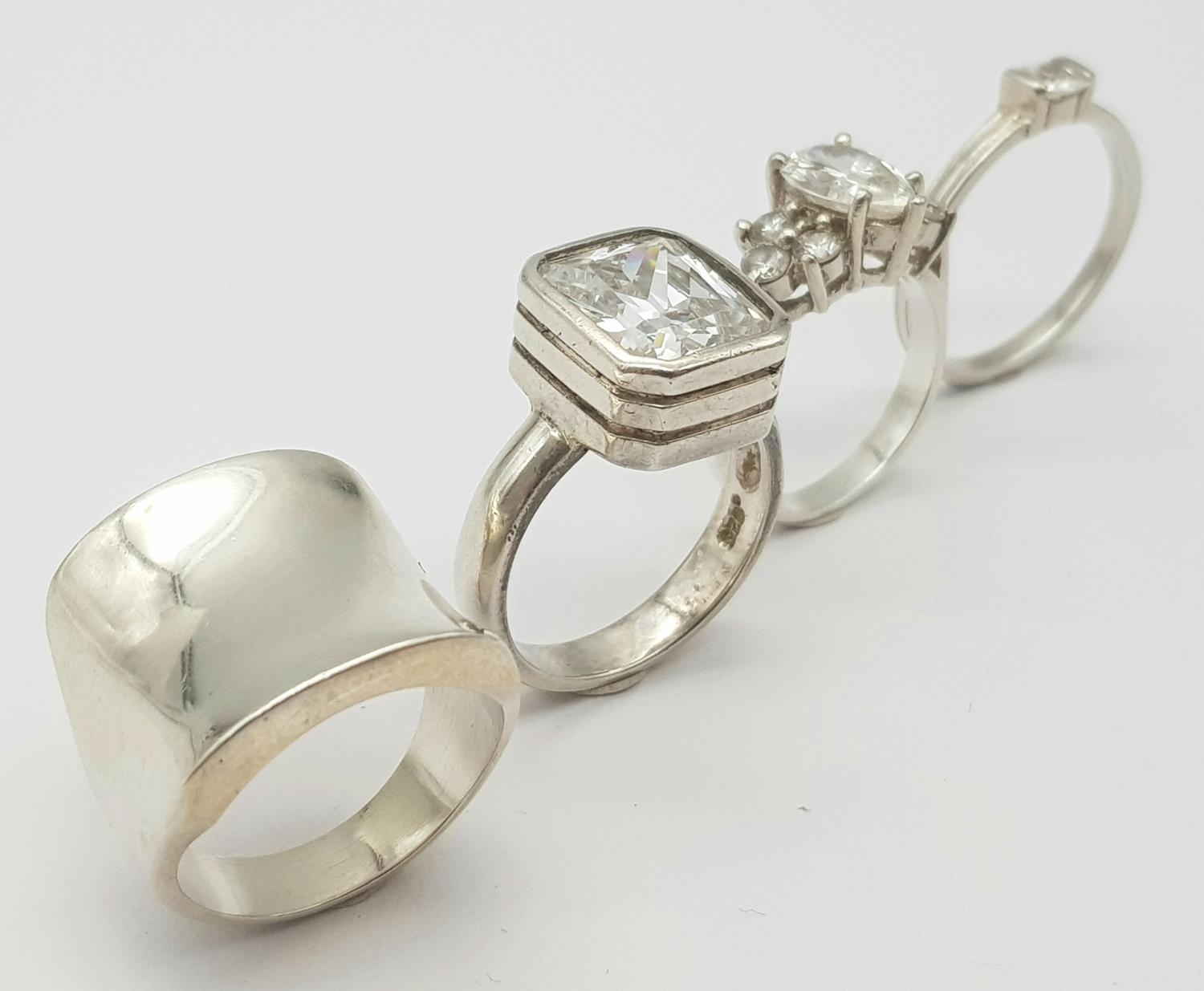 A Selection of 4 sterling silver rings, some set with cubic zirconia, sizes N-R, total weight 28.3g. - Image 2 of 6