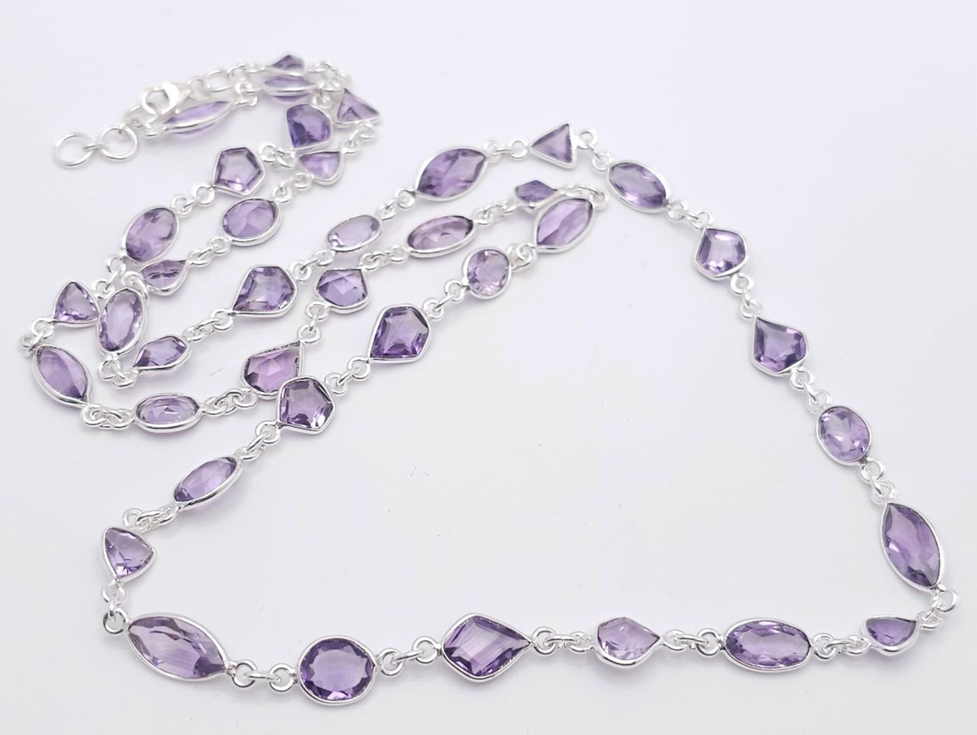 An Amethyst Multi-Shape Gemstone Long Chain Necklace. Set in 925 Silver. 68cm length. 20g. Ref: CD-