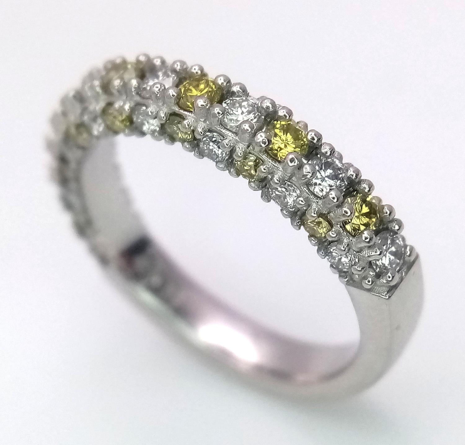 A Platinum White and Yellow Diamond Three-Sided Half Eternity Ring. Size L. 6.3g total weight. - Image 5 of 9