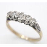 A Vintage 18K Gold and Platinum Five Diamond Ring. Size Q. 2.9g total weight.