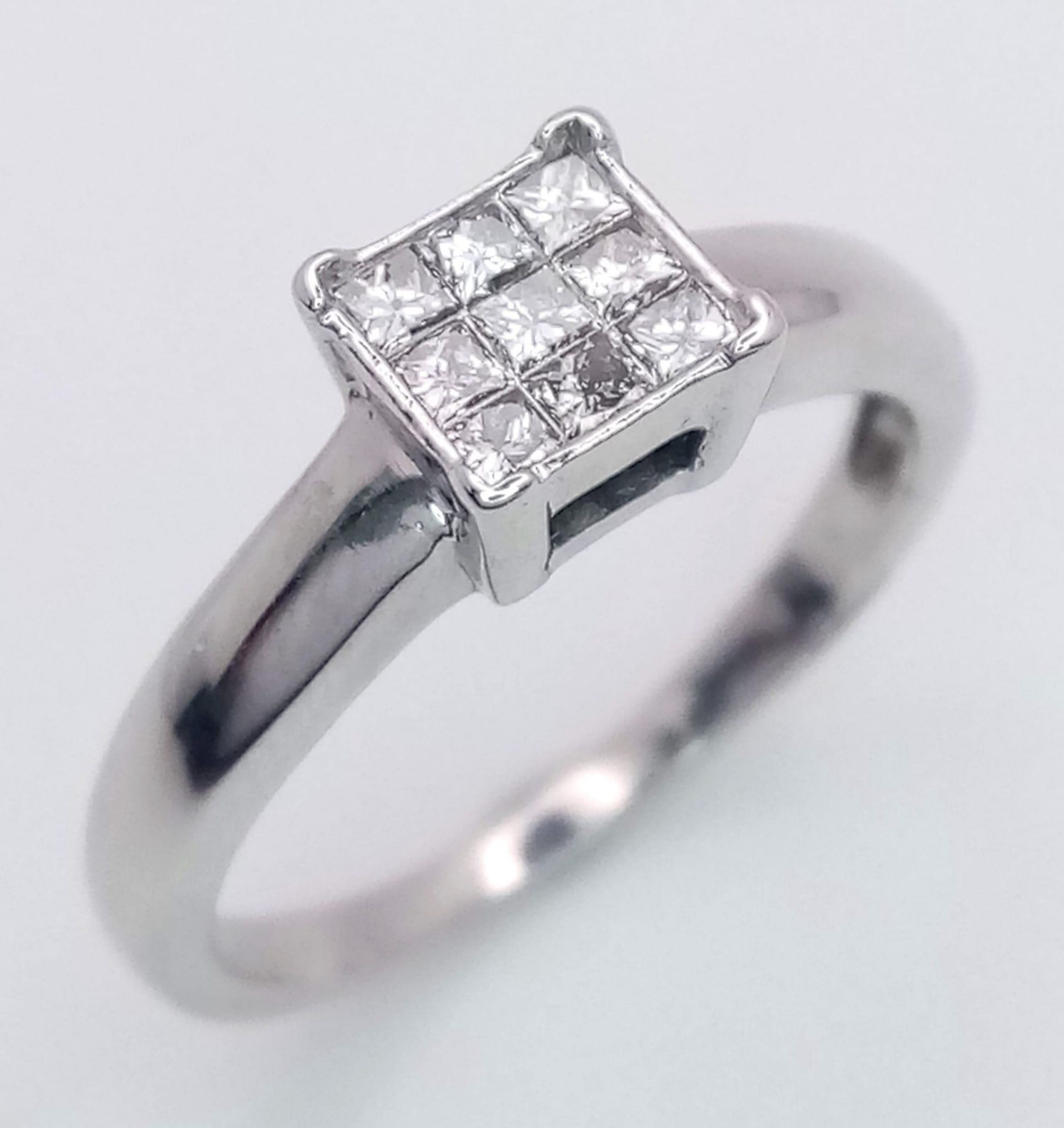 An 18K White Gold (tested) Diamond Ring. 0.30ct. Size M. 3g total weight.