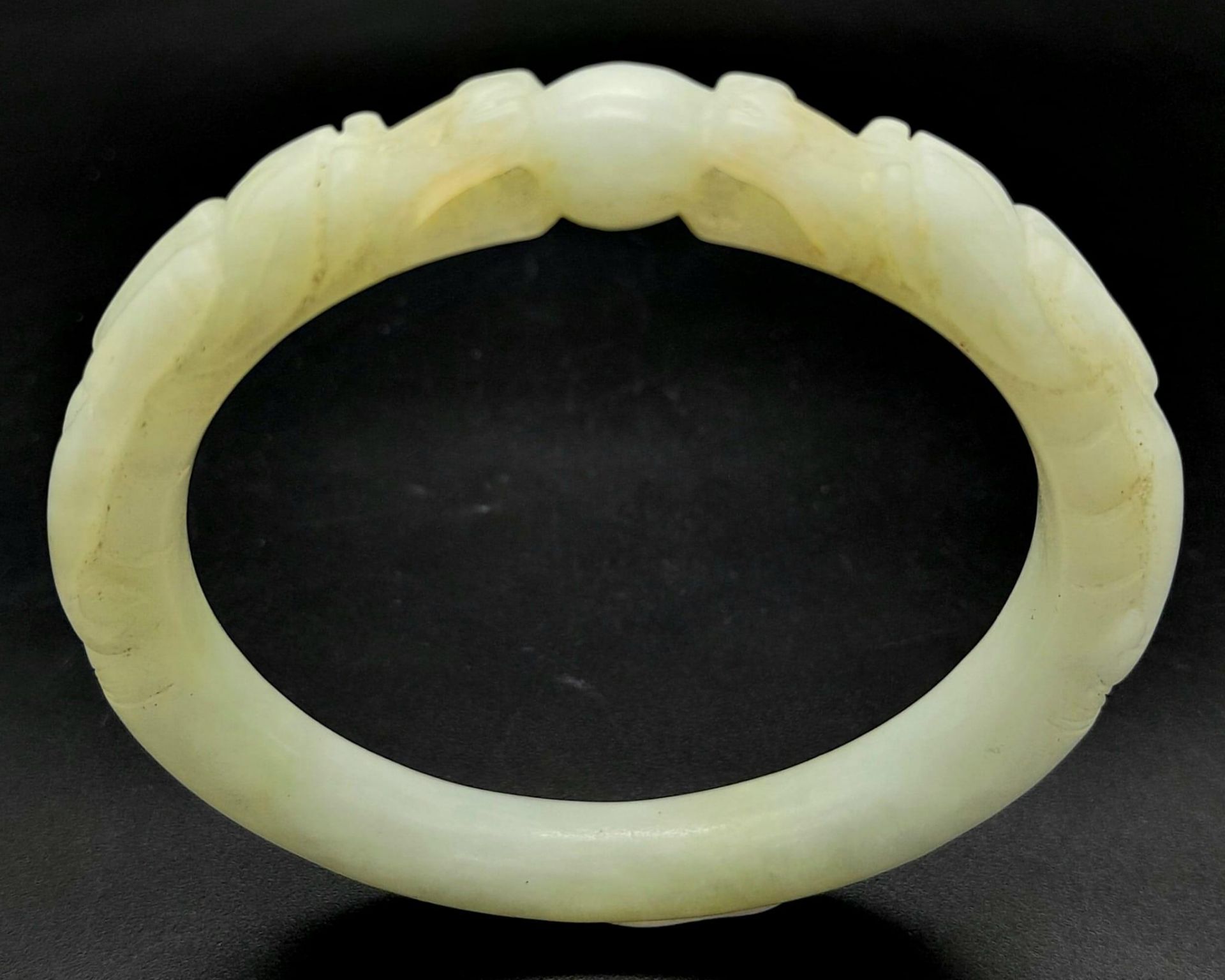 An Antique Chinese Pale Green Double Dragon Jade Bangle. 63mm inner diameter.