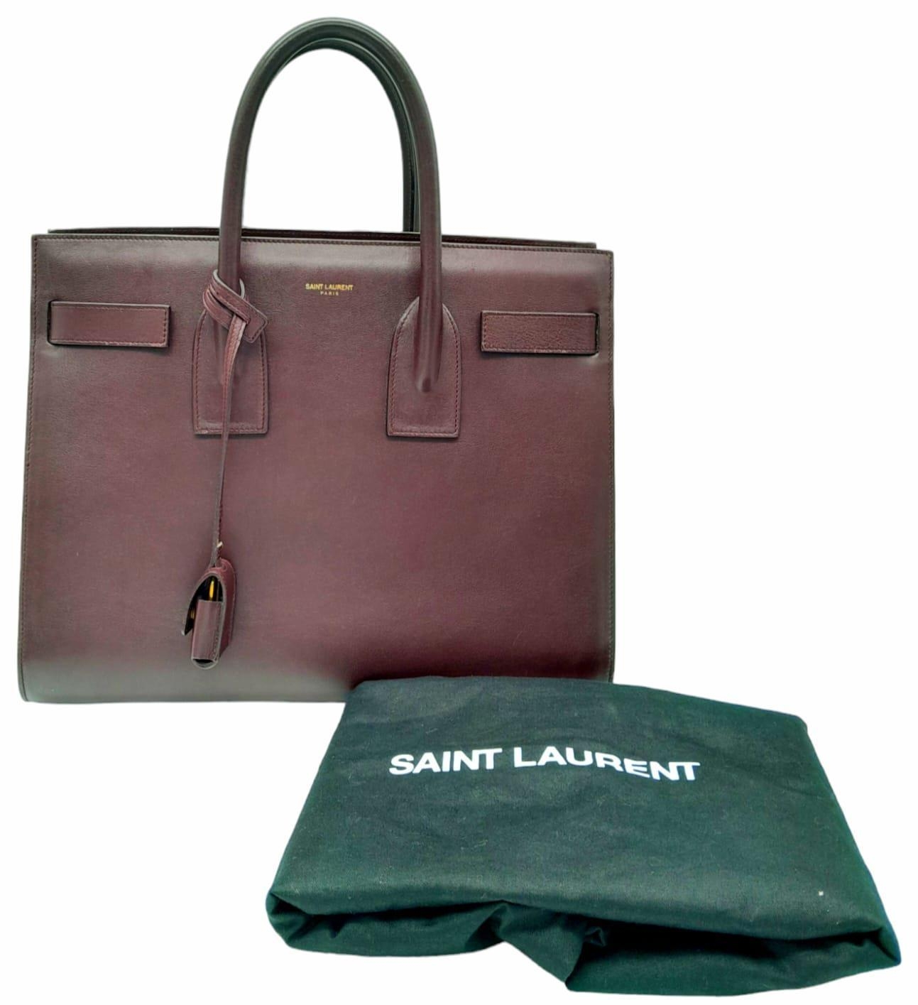 A Saint Laurent Sac De Jour Burgundy Handbag. Leather Exterior, Gold Tone Hardware, Double Handle in - Image 6 of 9