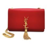 A YSL Red Kate Tassel Crossbody Bag. Leather exterior with gold-toned hardware, the iconic YSL logo,