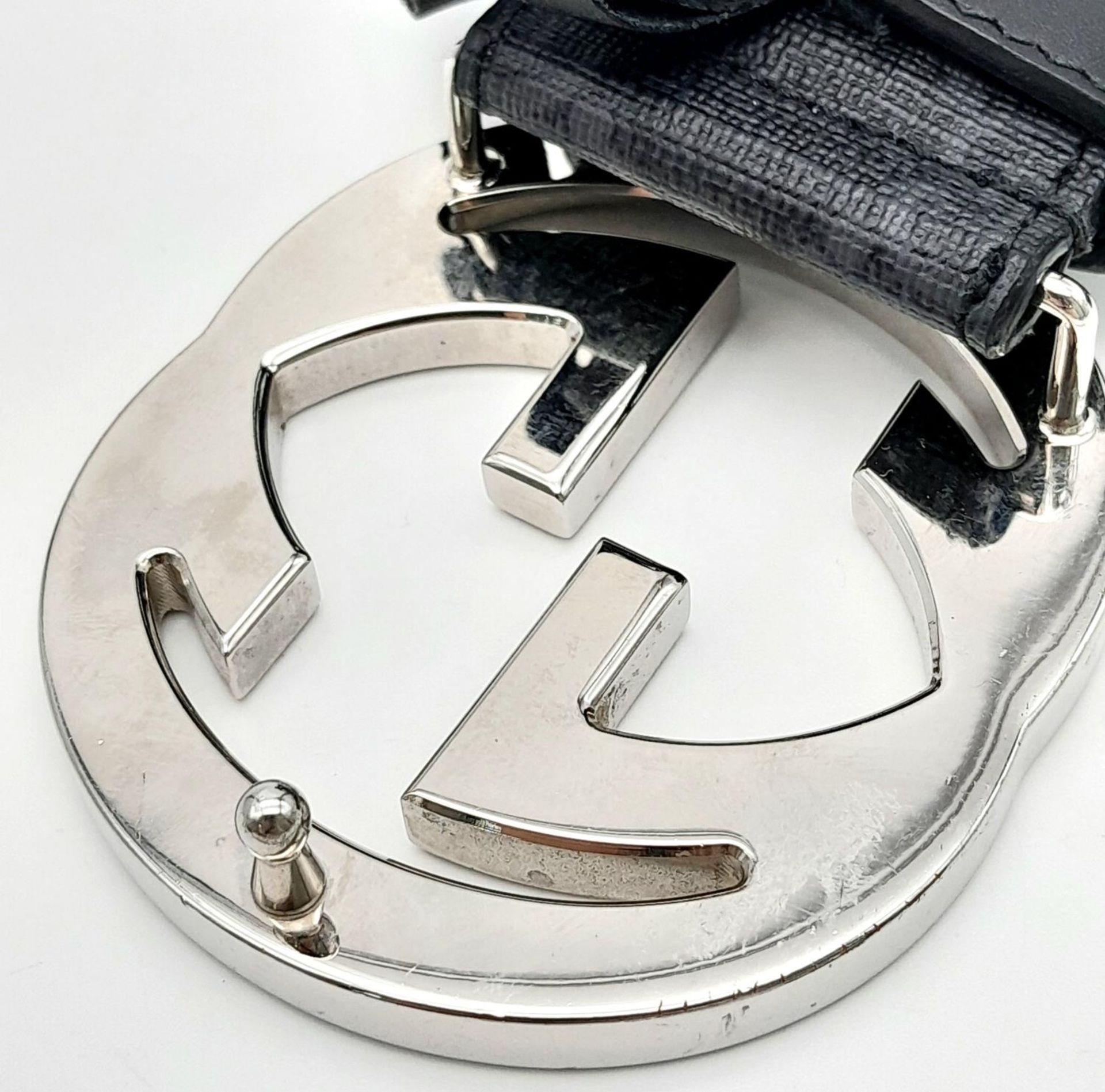 A Gucci Black with Grey Monogram Men's GG Belt. Silver-toned hardware. Approximately 104.5cm length, - Image 5 of 7