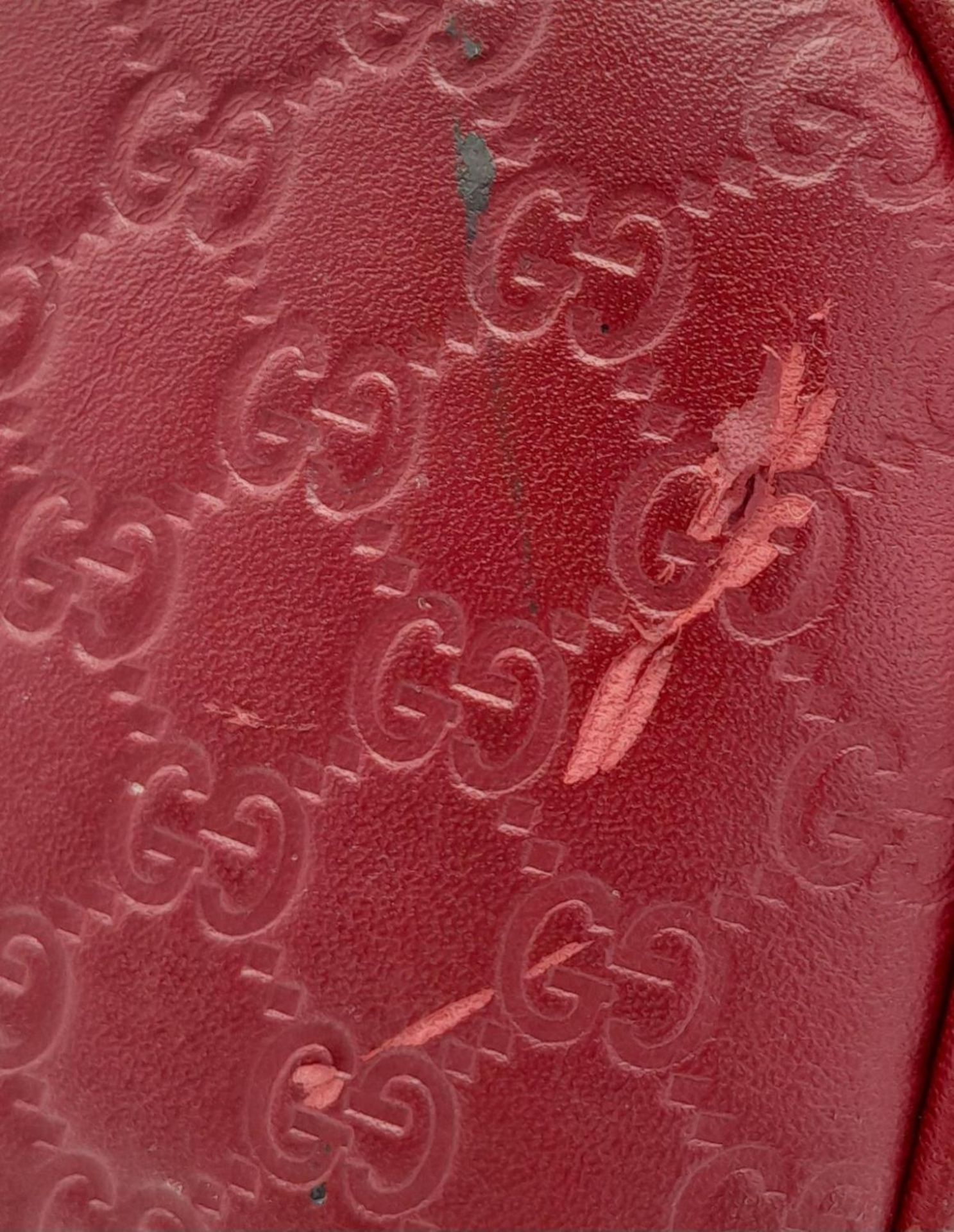 A Gucci Red Guccissima Dome Bag. Monogramed leather exterior with gold-toned hardware, two rolled - Image 7 of 10