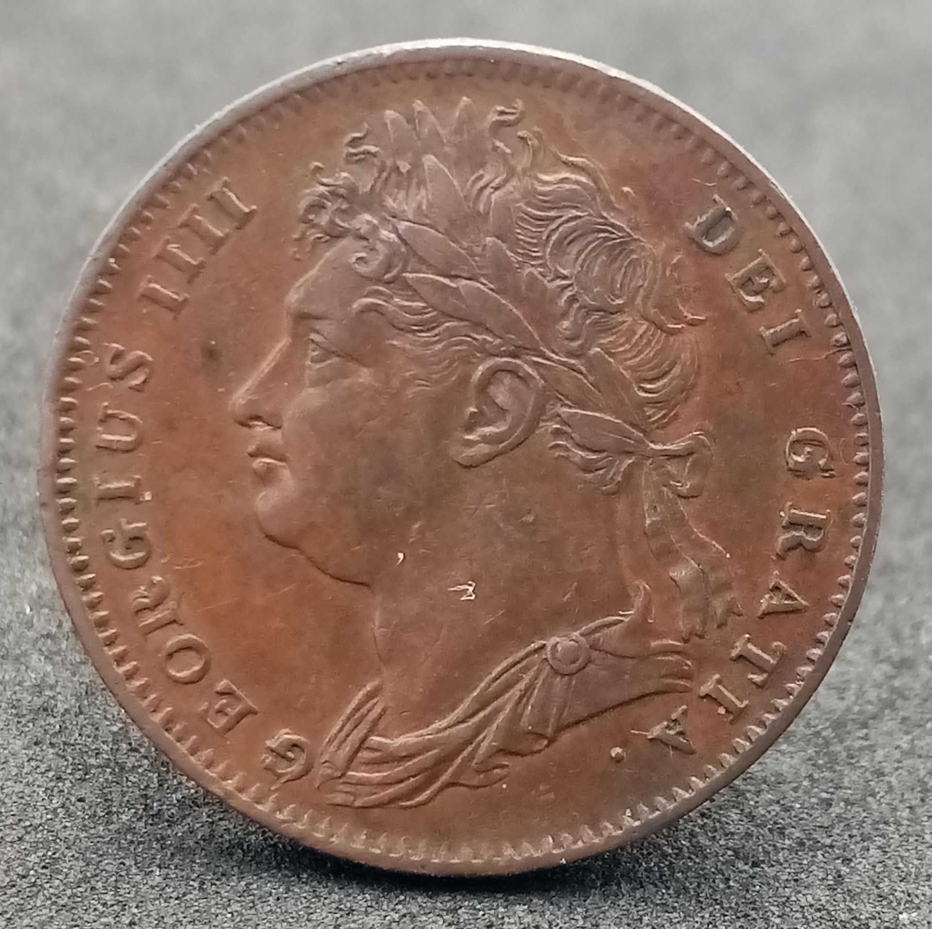 An 1822 George III Farthing.