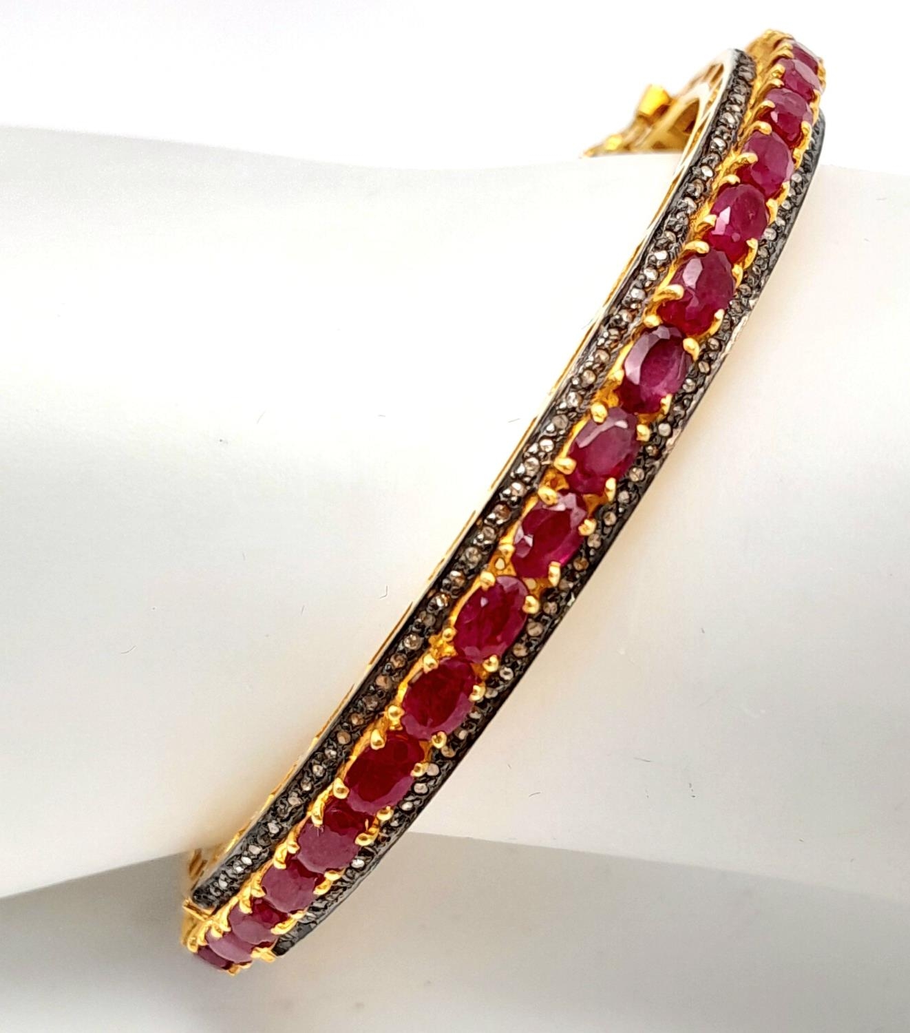 A Ruby Gemstone Bangle Bracelet with Old Cut Diamond Surround. Rubies - 12ctw. Set in 925 silver.