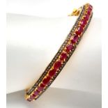 A Ruby Gemstone Bangle Bracelet with Old Cut Diamond Surround. Rubies - 12ctw. Set in 925 silver.