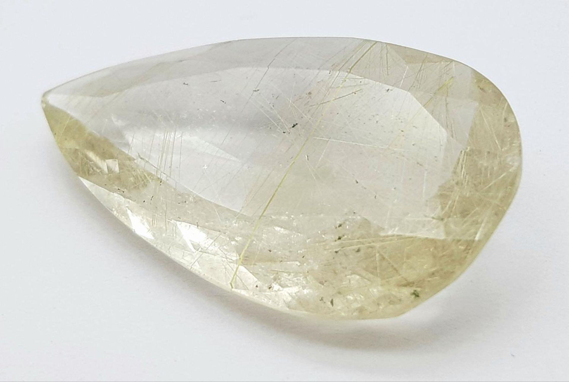 A 21.05ct Rutile Quartz Gemstone - GFCO Swiss Certified.