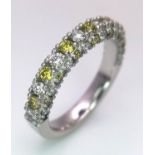 A Platinum White and Yellow Diamond Three-Sided Half Eternity Ring. Size L. 6.3g total weight.