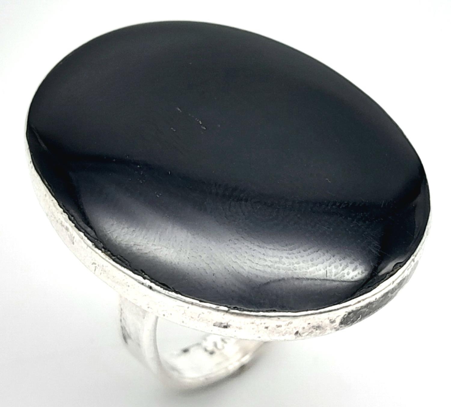 A Mexican silver and black onyx pendant (83mm x 46mm) and ring (size L) total weight 60.4g. ref: - Image 2 of 6