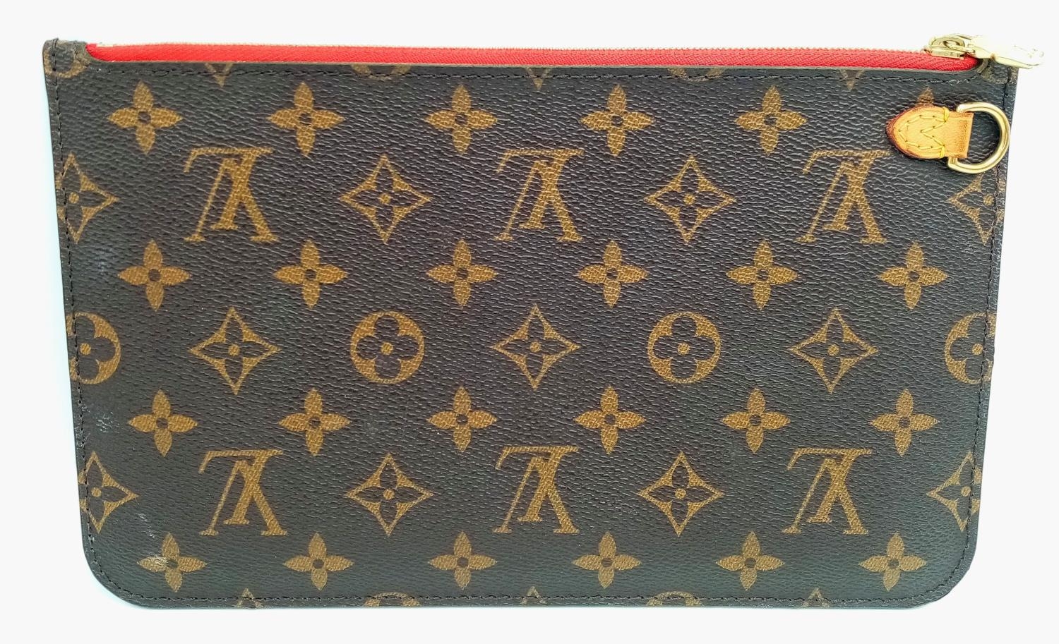 A Louis Vuitton Neverfull Pochette. Monogramed canvas exterior with gold-toned hardware and zip - Image 2 of 7