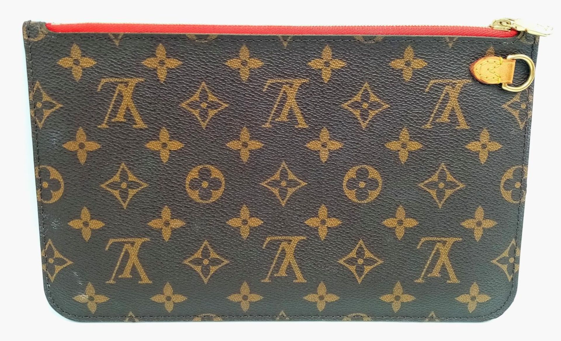 A Louis Vuitton Neverfull Pochette. Monogramed canvas exterior with gold-toned hardware and zip - Image 2 of 7