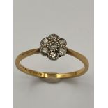 Vintage 18 carat GOLD RING with PLATINUM set DIAMONDS mounted in floral formation. 1.9 grams. Size P