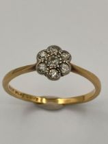Vintage 18 carat GOLD RING with PLATINUM set DIAMONDS mounted in floral formation. 1.9 grams. Size P