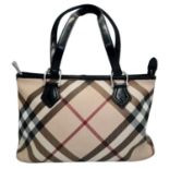A Burberry Beige Check Nova Bag. Coated canvas exterior with leather trim, two leather straps,