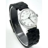 A Vintage Timex Mechanical Watch. Black rubber strap. Stainless steel case - 30mm. White dial with