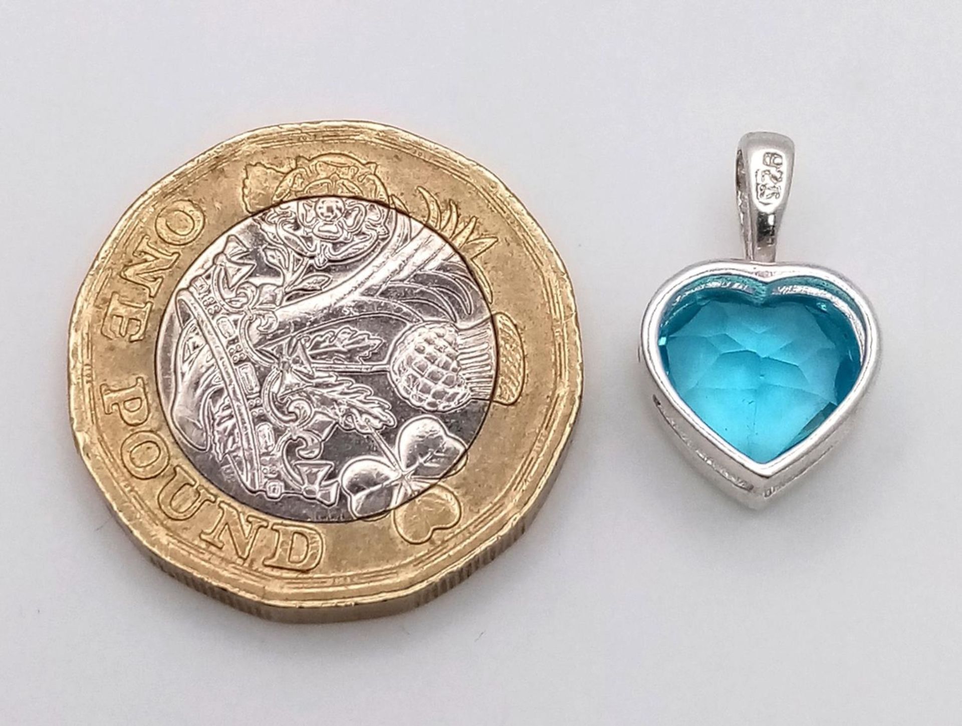 A Blue Topaz Heart Pendant on 925 Silver. 1.7cm length, 1.62g total weight. - Image 4 of 4