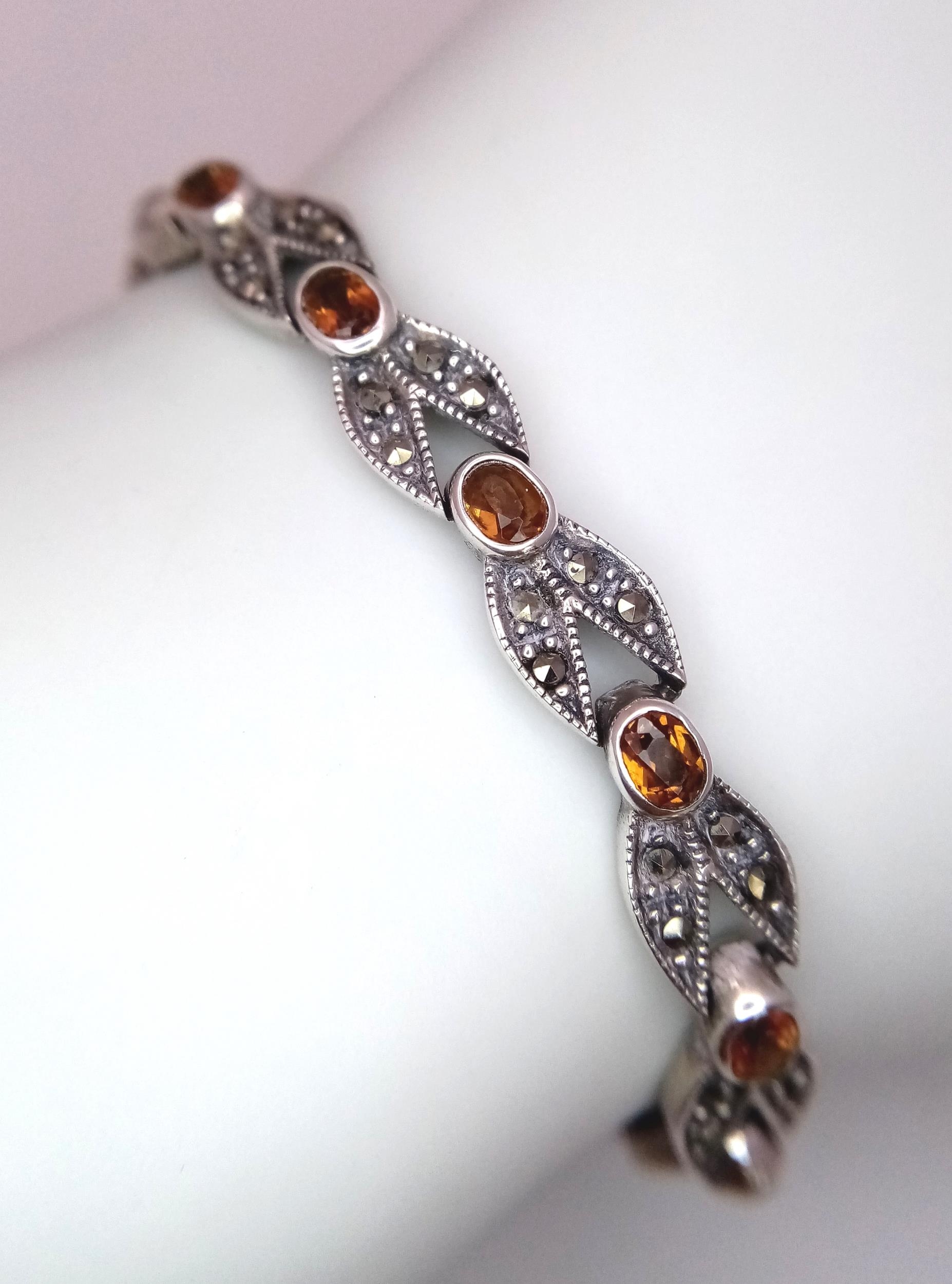 A Marcasite and Citrine Bracelet. White metal, boxed. 18cm