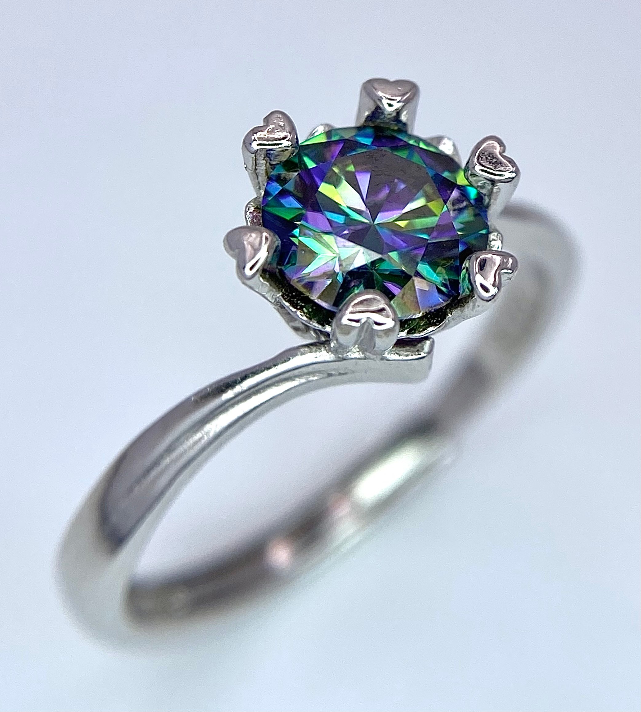 A 1ct Rainbow Moissanite and 925 Silver Ring. Size N. Comes with a GRA certificate.