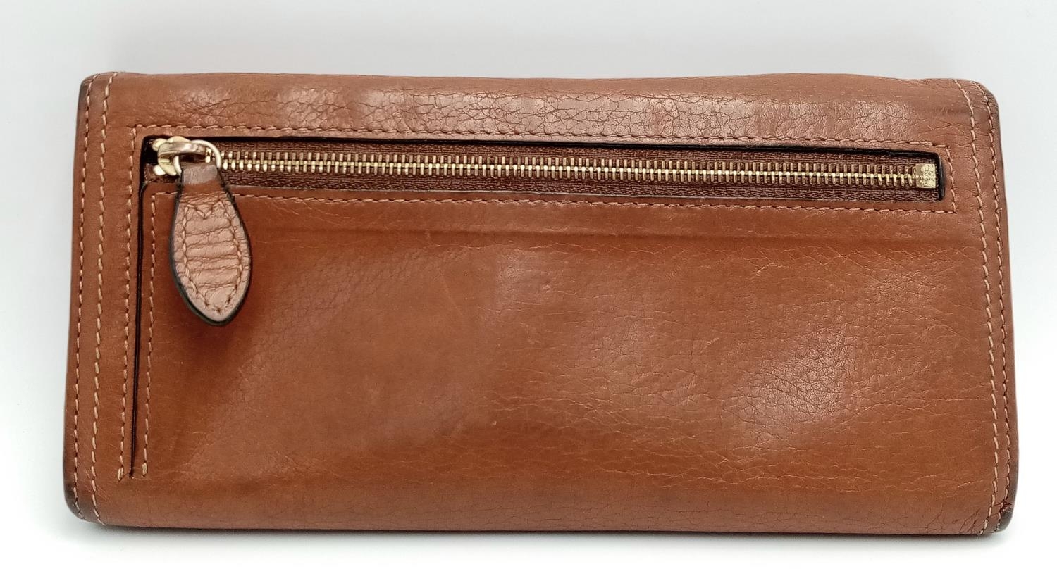 A Mulberry Brown Daria Continental Wallet. Leather exterior with gold-toned hardware, a zipped - Image 5 of 7
