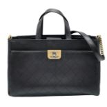 A Chanel black quilted caviar leather straight line tote bag. Silver and gold tone hardware, studded