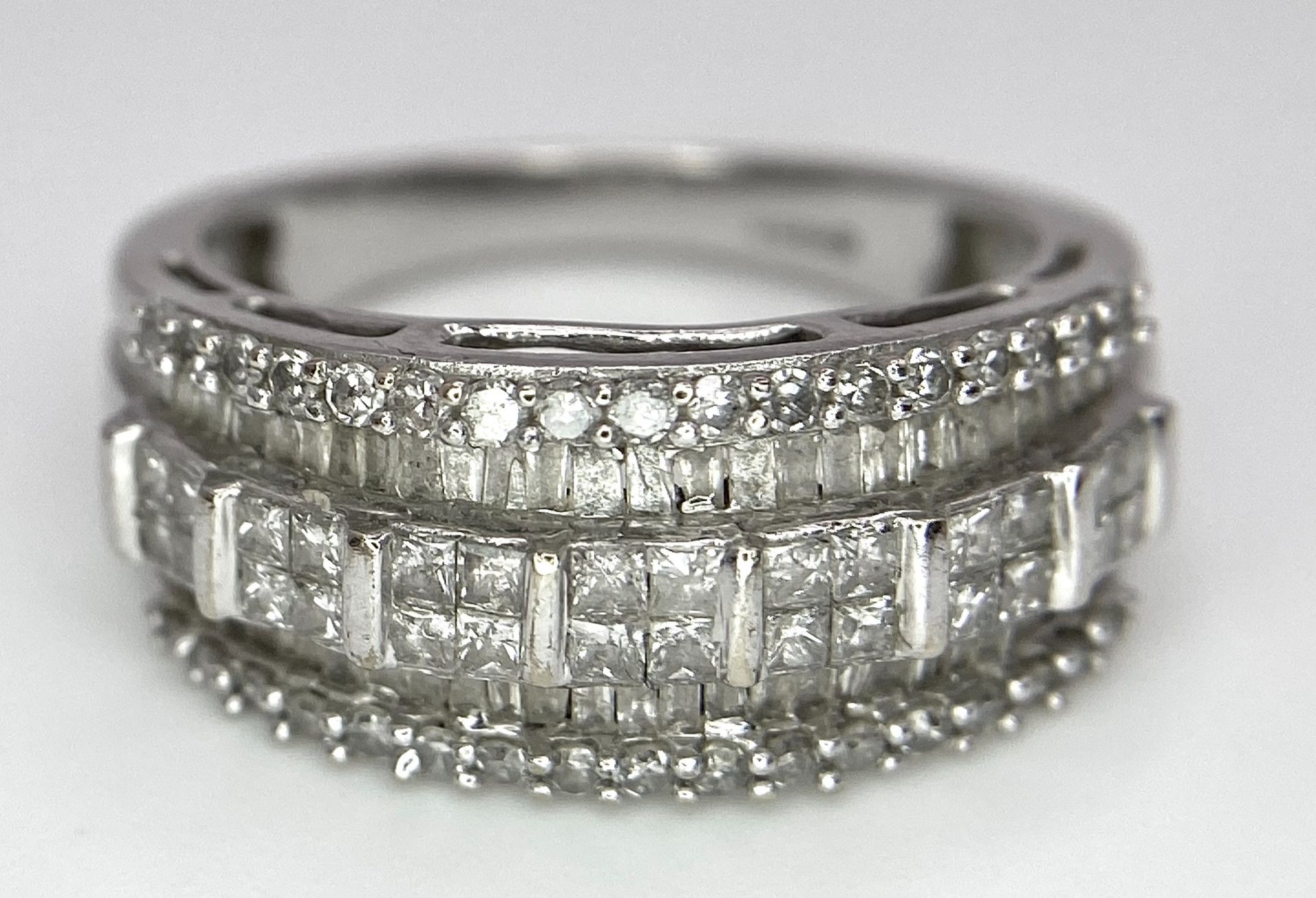 A 9K White Gold Mixed Cut Diamond Ring. Five rows of, square, round and baguette cut diamonds. - Image 4 of 7