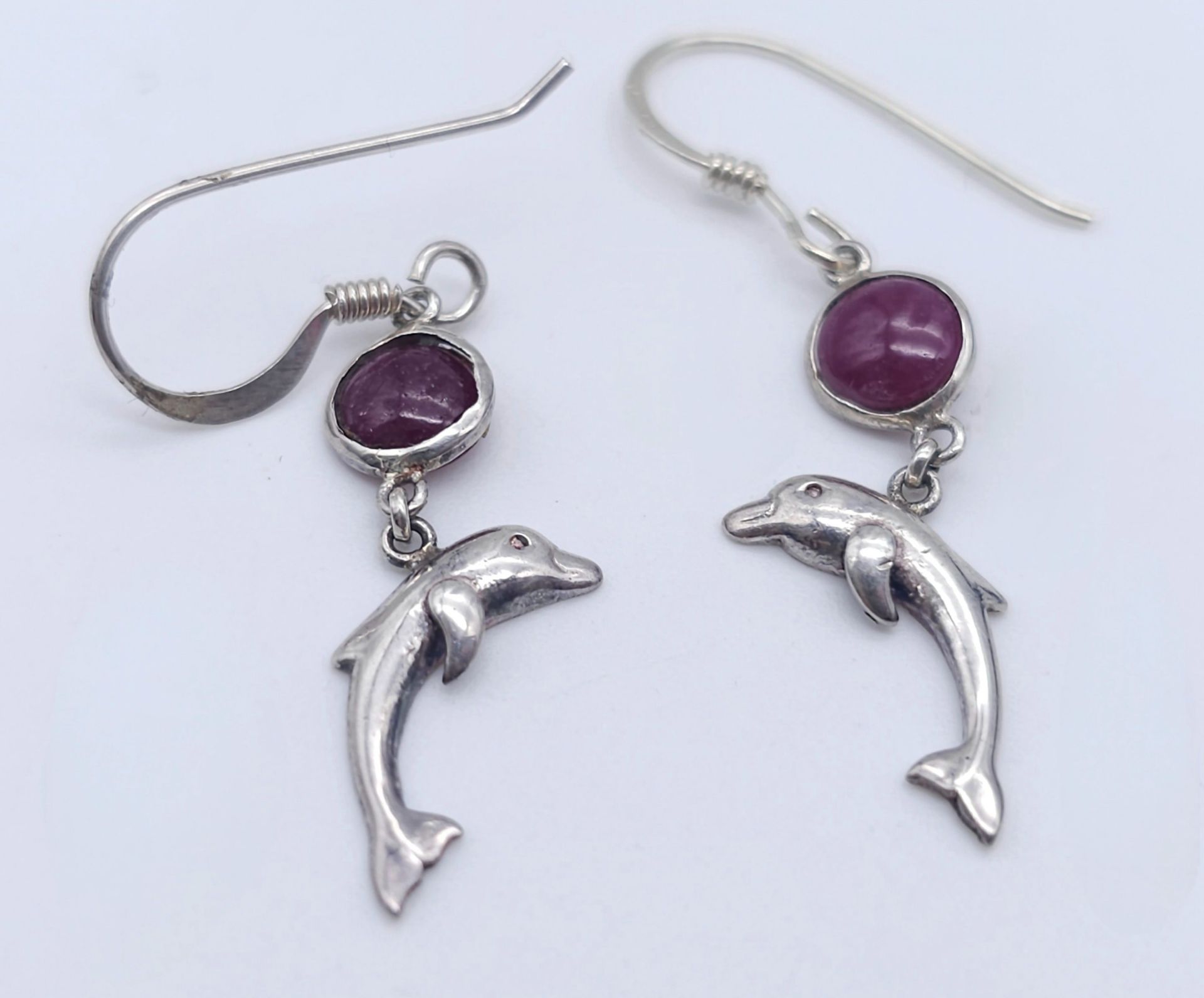 A Pair of Sterling Silver Ruby Set Dolphin Pendant Earrings. 2.5cm Drop. Set with 5mm Round Cut Ruby - Image 2 of 5