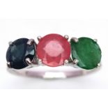 An Emerald, Sapphire and Ruby Three Stone Ring on 925 Silver. Size N1/2, 2.4g total weight.