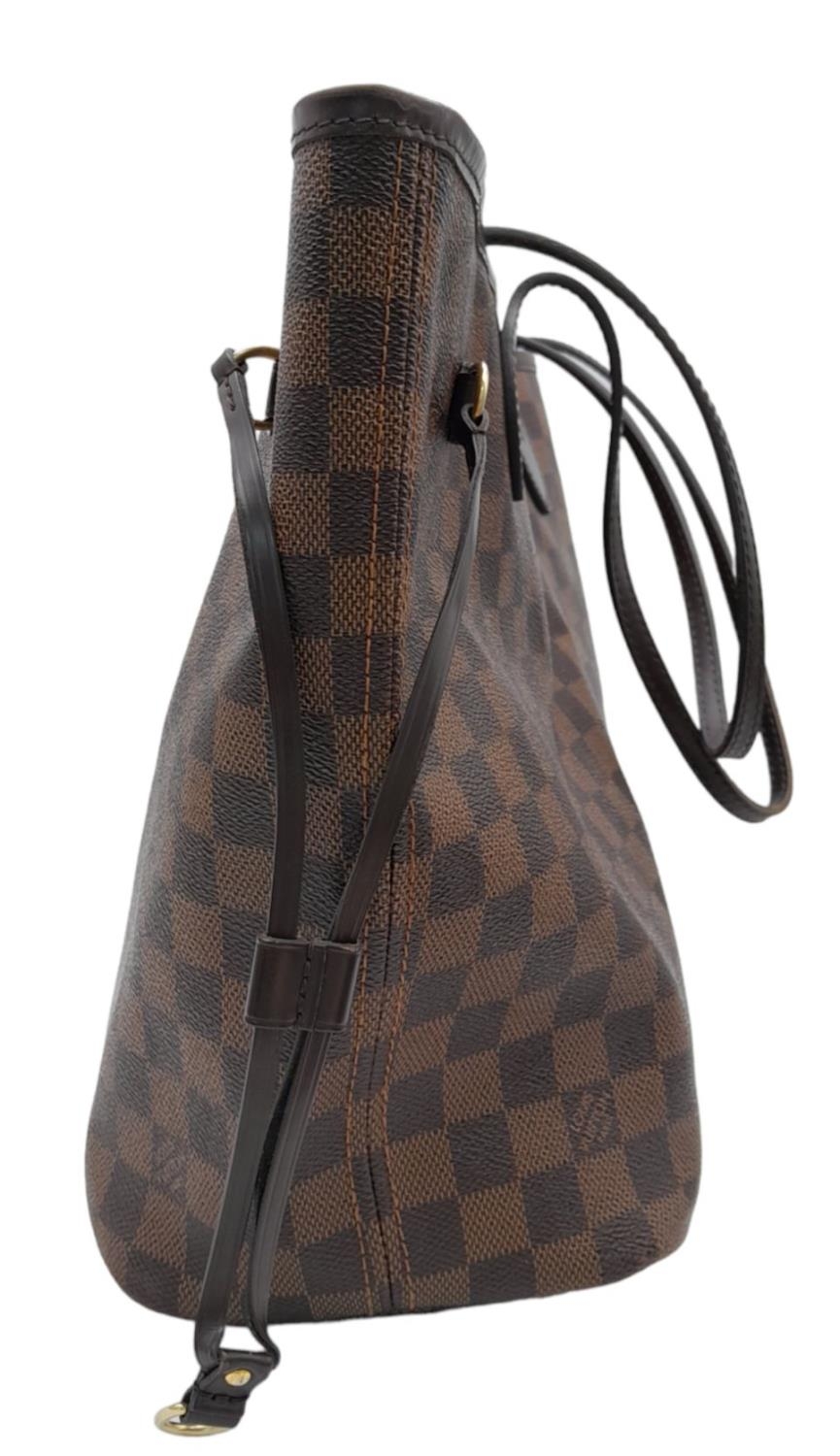 A Louis Vuitton Neverfull Damier Ebene Bag. Coated canvas exterior with leather trim, gold-toned - Image 7 of 12