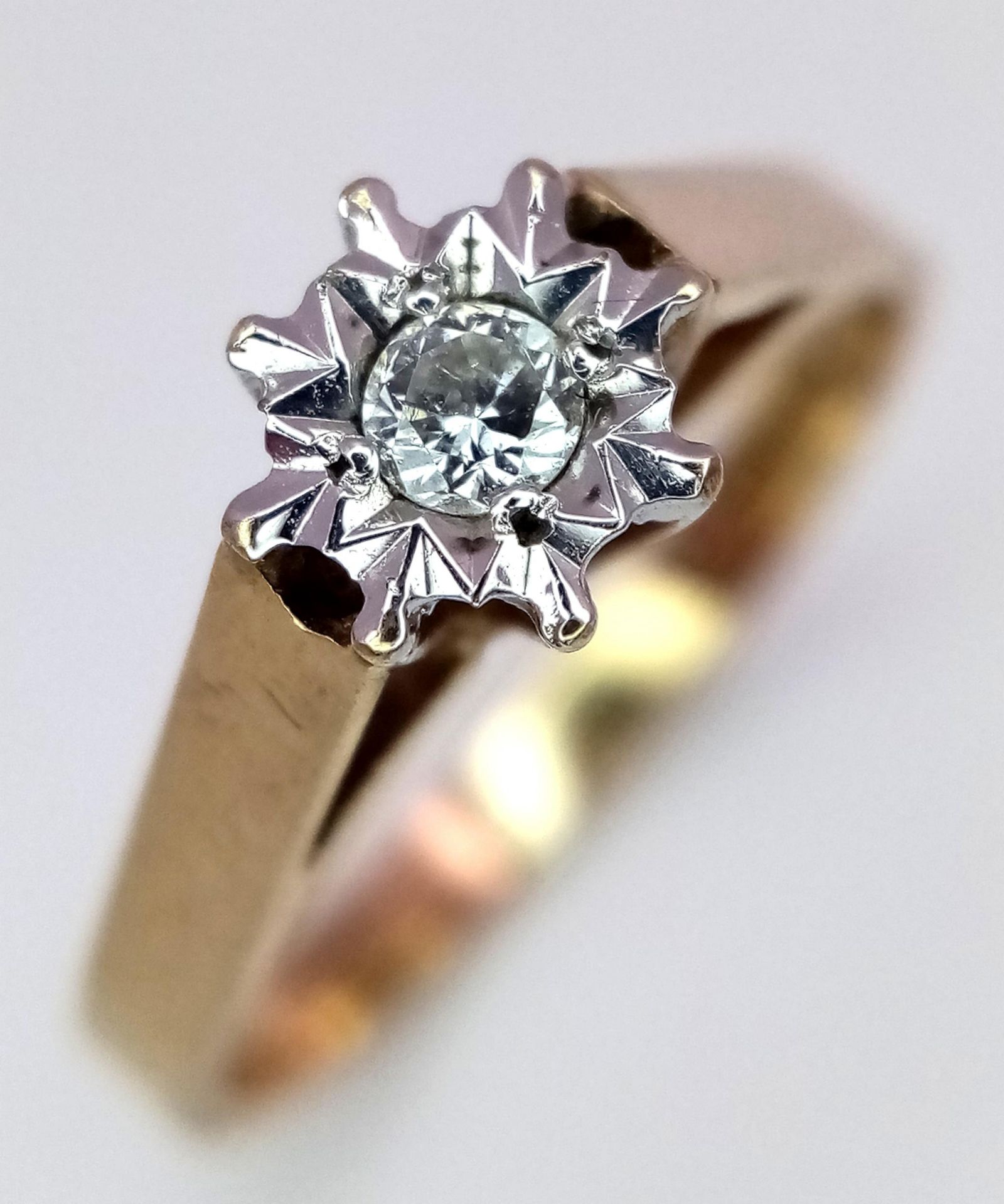 A 9K Yellow Gold Diamond Solitaire Ring. 0.15ct. Size K. 1.9g total weight.