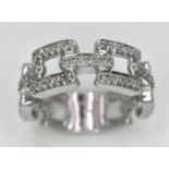 A 9K WHITE GOLD DIAMOND SET LINK RING. 0.25ctw, Size N, 4.7g total weight. Ref: SC 8003