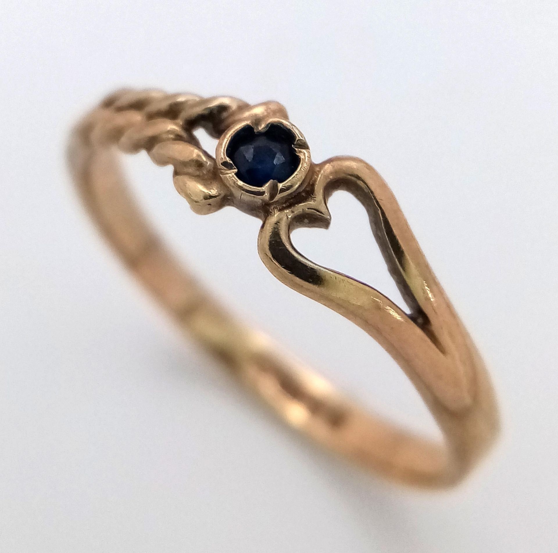 A 9K Yellow Gold and Sapphire Love Ring. Size J. 1.1g weight. - Image 3 of 5