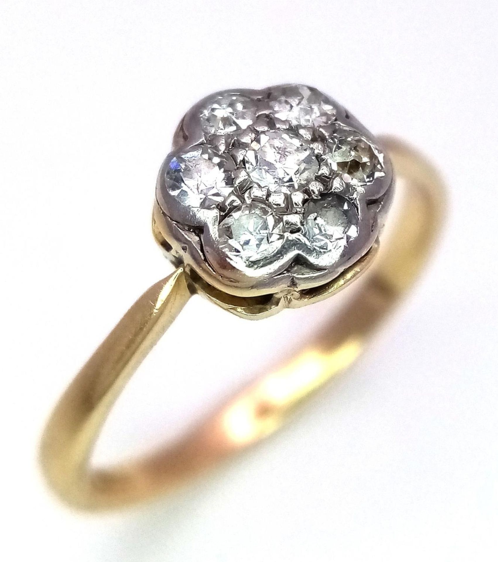 AN 18K YELLOW GOLD & PLATINUM VINTAGE OLD CUT DIAMOND CLUSTER RING. 0.25ctw, size M, 2g total