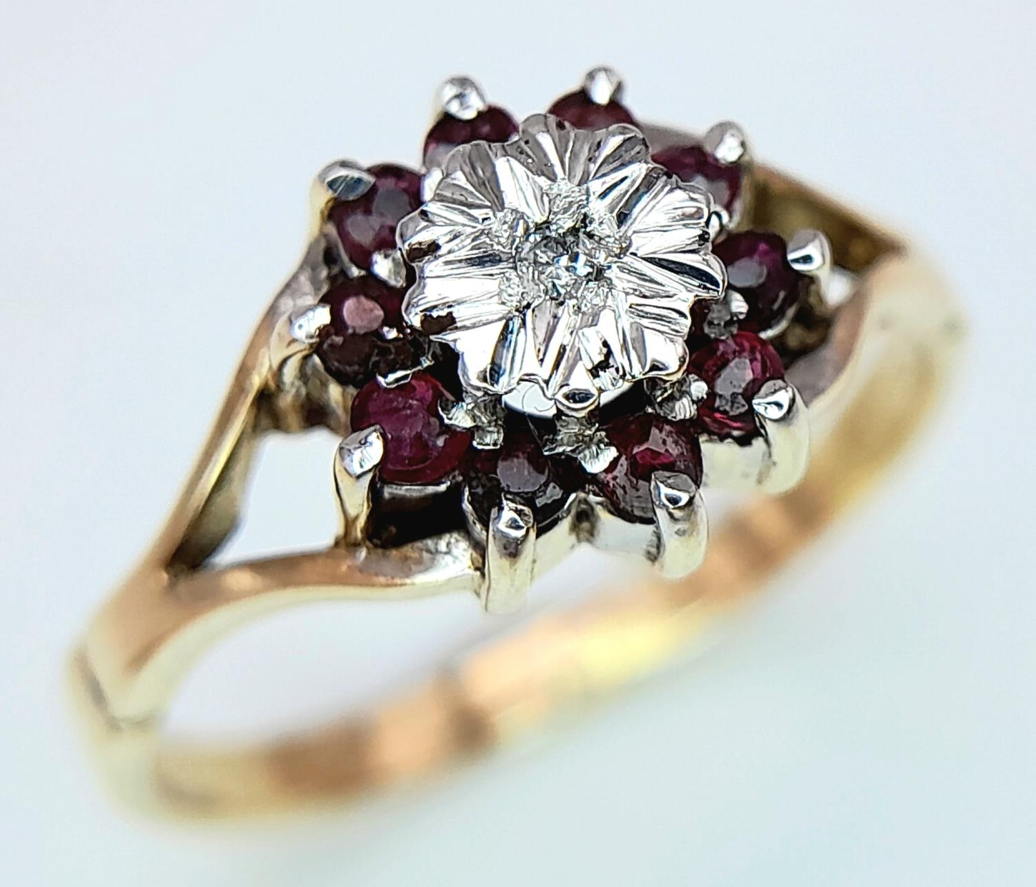 A 9K (TESTED AS) YELLOW GOLD DIAMOND & RUBY CLUSTER RING 1.5G SIZE I 1/2. ref: SPAS 9023