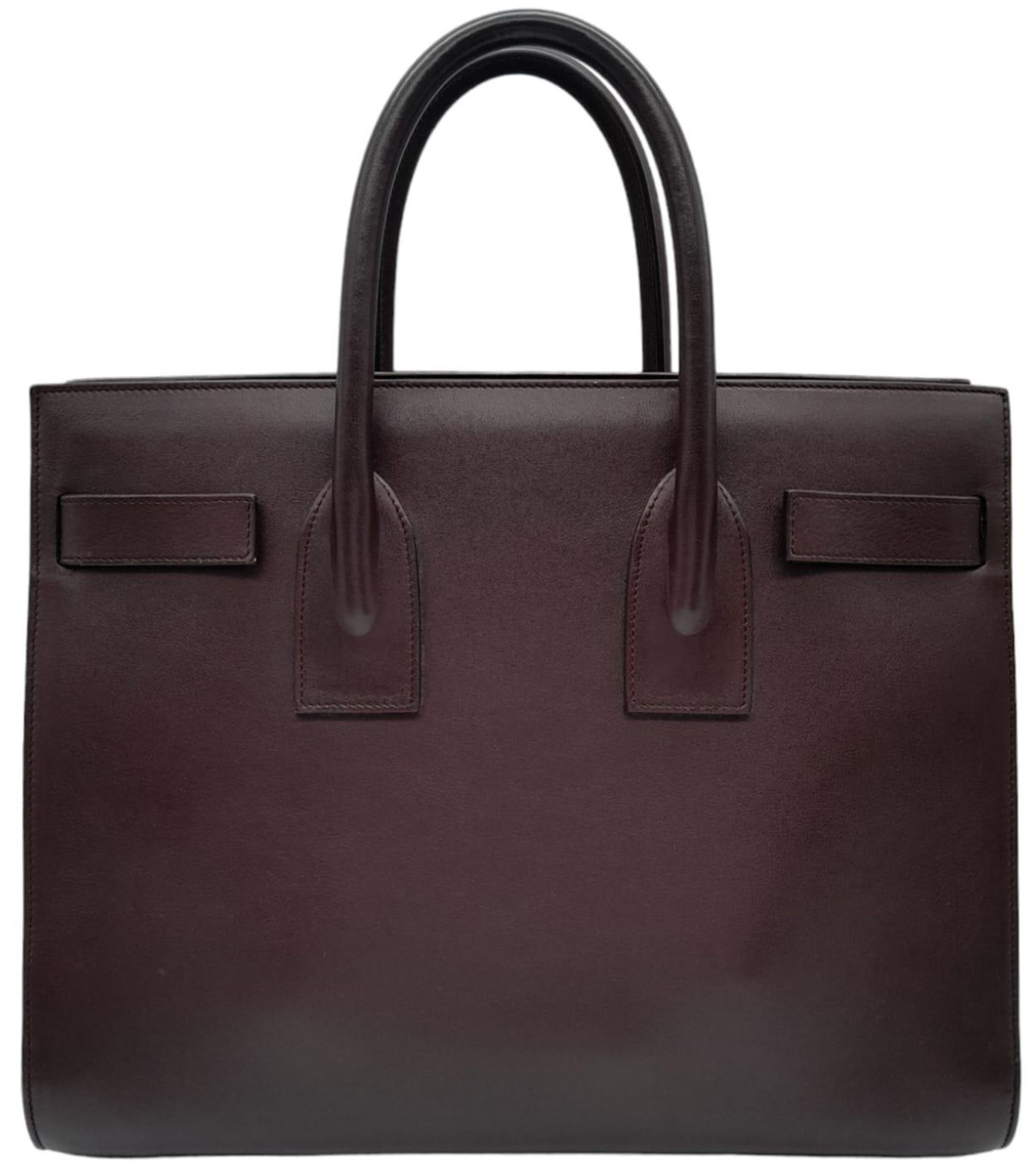 A Saint Laurent Sac De Jour Burgundy Handbag. Leather Exterior, Gold Tone Hardware, Double Handle in - Bild 2 aus 9