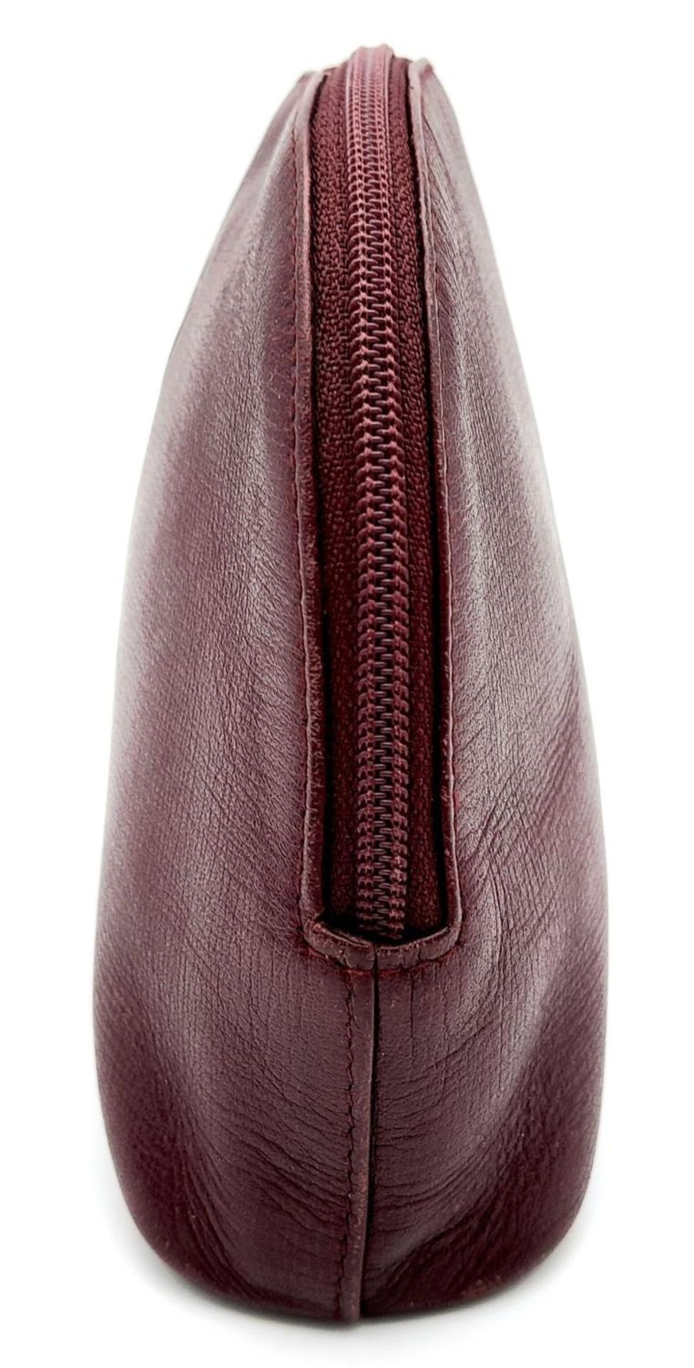 A Vintage Cartier Burgundy Pouch. Leather exterior with zip top closure. Burgundy canvas interior. - Image 2 of 11