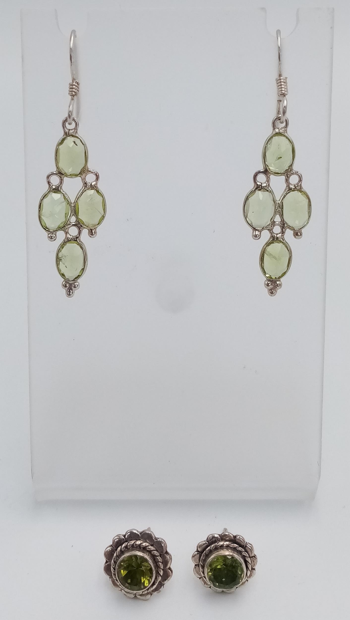 Two Pairs of Sterling Silver Peridot Set Earrings Comprising 1) A Pair of Oval Cut 4 Stone Dangle