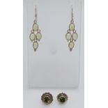 Two Pairs of Sterling Silver Peridot Set Earrings Comprising 1) A Pair of Oval Cut 4 Stone Dangle