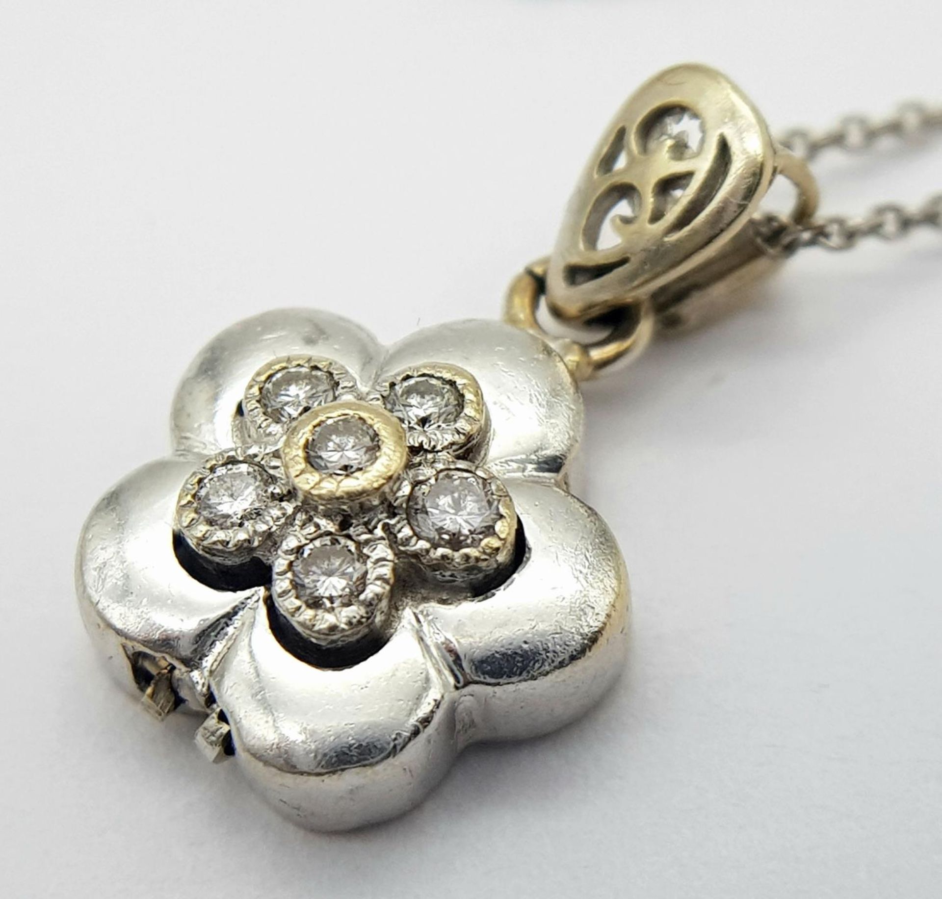 A 18ct White Gold Diamond Flower Necklace, 0.12ct diamond, 18” length, 12mm x 12mm pendant , 4.3g - Image 3 of 5