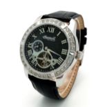 An Ingersoll Masterpiece Skeleton Gents Automatic Watch. Black leather strap. Stainless steel case -