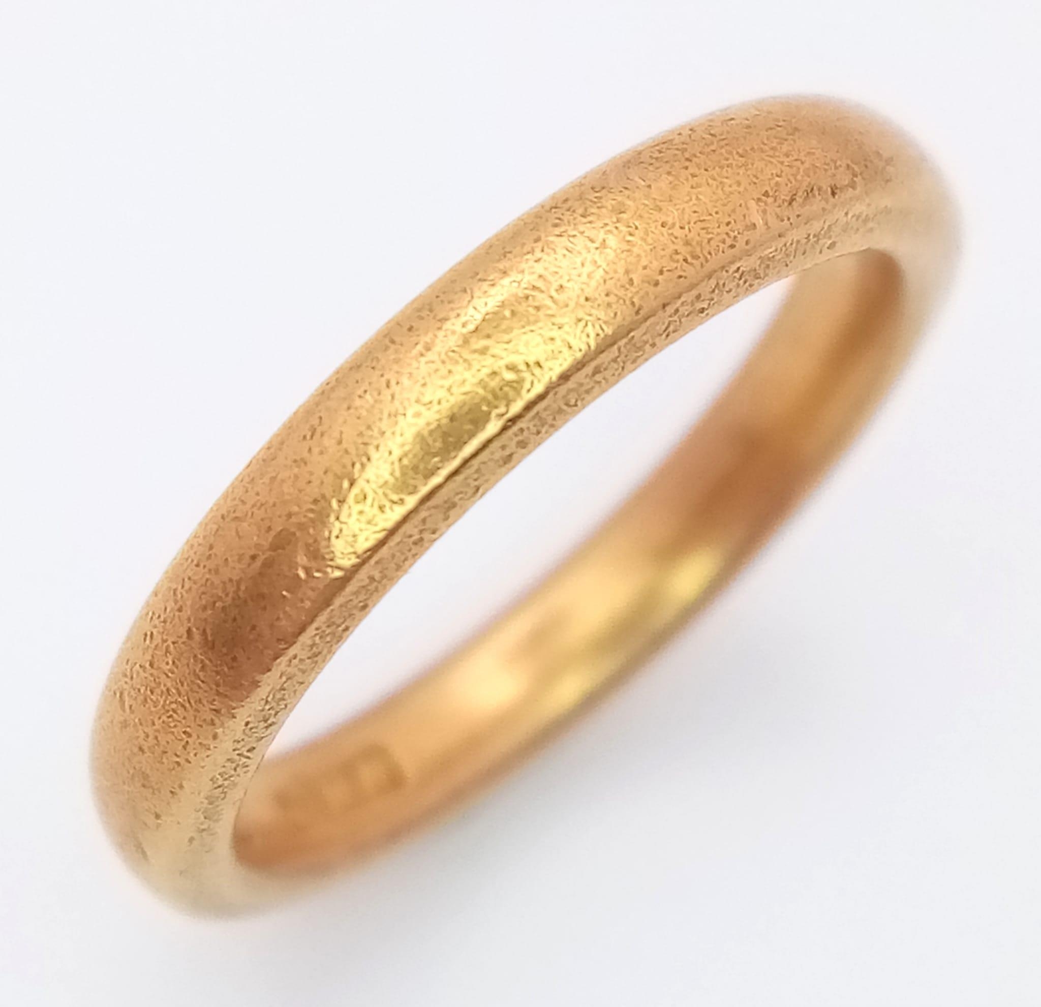 A Vintage 22K Yellow Gold Band Ring. 3mm width. Size K. 5.47g weight. Full UK hallmarks.